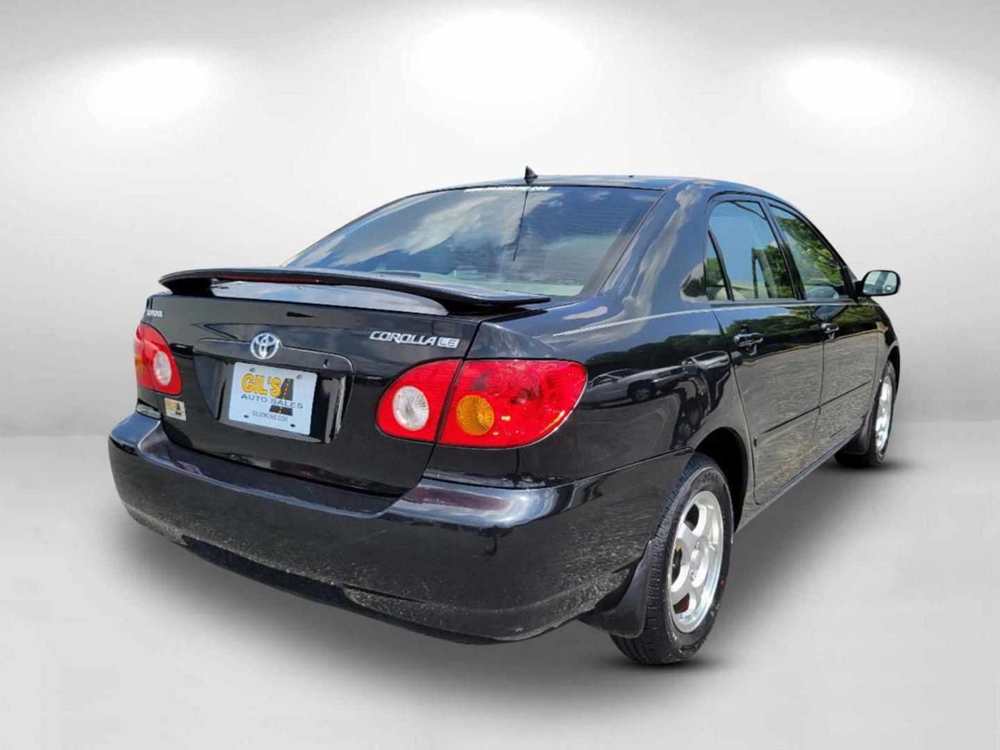 2003 Black /Gray Toyota Corolla LE (JTDBR32E730) with an Gas I4 1.8L/108 engine, 4-Speed Automatic w/OD transmission, located at 1430 Gateway Drive, Opelika, AL, 36801, (334) 239-0944, 32.637871, -85.409790 - 2003 Toyota Corolla LE - Photo#4