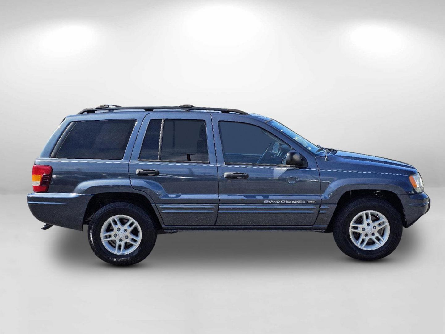 2004 Steel Blue Pearl /Dark Slate Gray Jeep Grand Cherokee Laredo (1J4GX48S34C) with an Gas I6 4.0L/242 engine, 4-Speed Automatic w/OD transmission, located at 804 22nd Ave, Phenix City, AL, 36870, (334) 297-1860, 32.484749, -85.024475 - 2004 Jeep Grand Cherokee Laredo - Photo#3