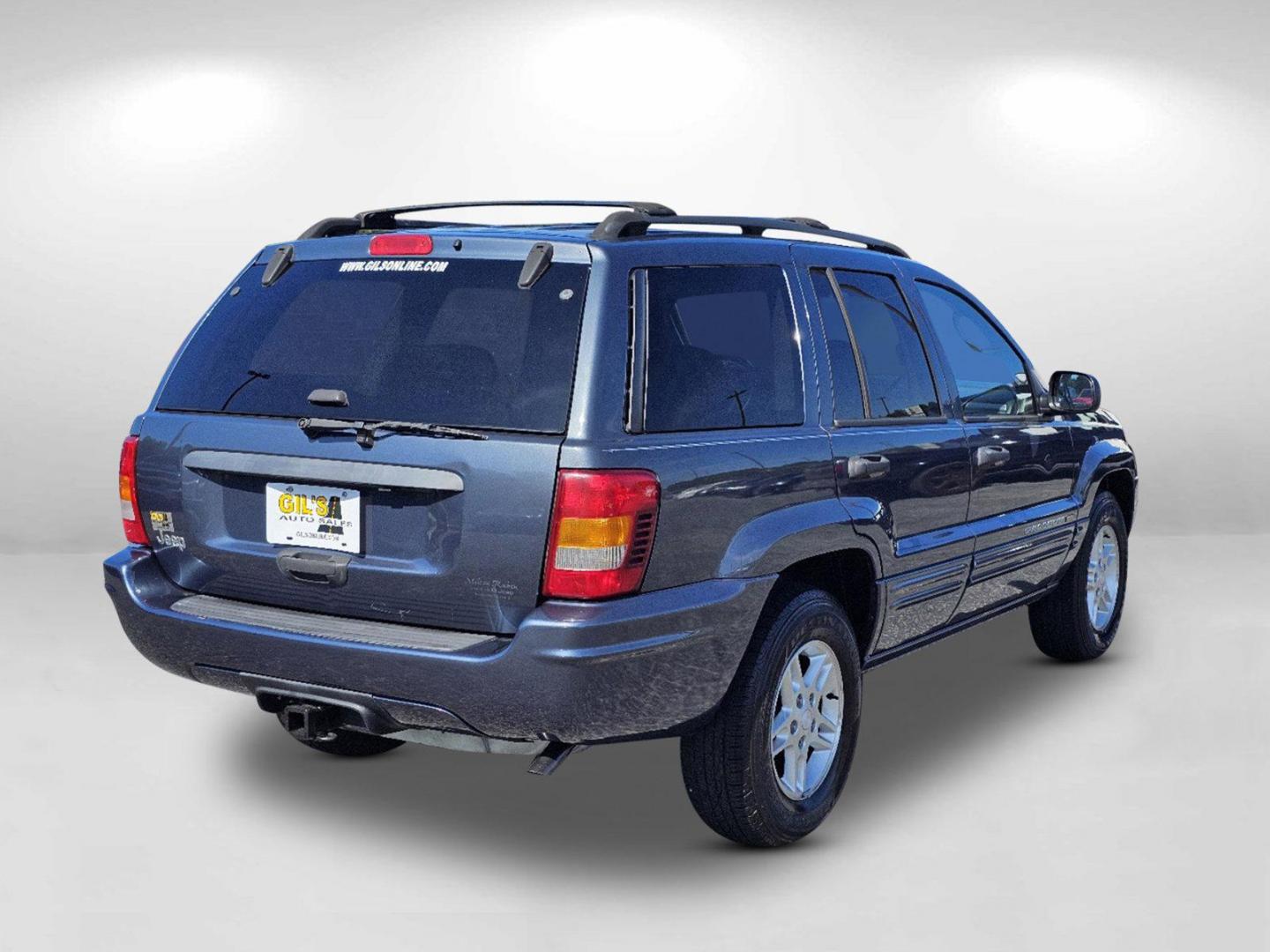 2004 Steel Blue Pearl /Dark Slate Gray Jeep Grand Cherokee Laredo (1J4GX48S34C) with an Gas I6 4.0L/242 engine, 4-Speed Automatic w/OD transmission, located at 804 22nd Ave, Phenix City, AL, 36870, (334) 297-1860, 32.484749, -85.024475 - 2004 Jeep Grand Cherokee Laredo - Photo#4