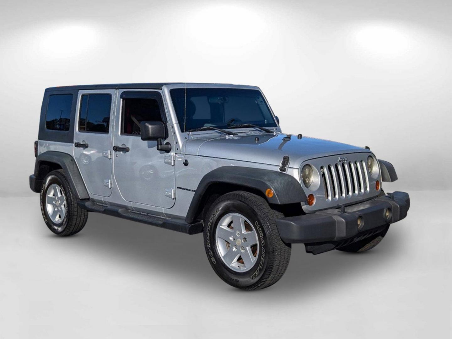 2010 /Dark Slate Gray/Medium Slate Gray Jeep Wrangler Unlimited Sport (1J4BB3H13AL) with an Gas V6 3.8L/231 engine, 4-Speed Automatic transmission, located at 3959 U.S. 80 W, Phenix City, AL, 36870, (334) 297-4885, 32.469296, -85.135185 - 2010 Jeep Wrangler Unlimited Sport - Photo#5