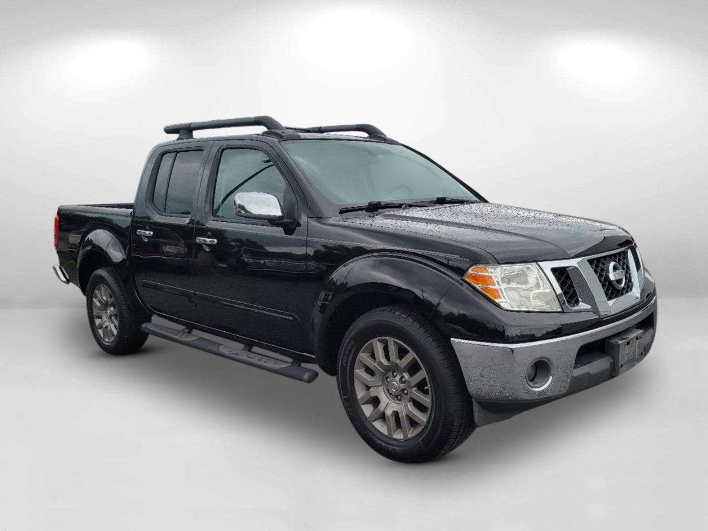 2010 Super Black /Graphite Nissan Frontier LE (1N6AD0ER7AC) with an Gas V6 4.0L/ engine, 5-Speed Automatic w/OD transmission, located at 7000 Northlake Connector, Columbus, GA, 31904, (706) 987-8085, 32.524975, -84.978134 - 2010 Nissan Frontier LE - Photo#2