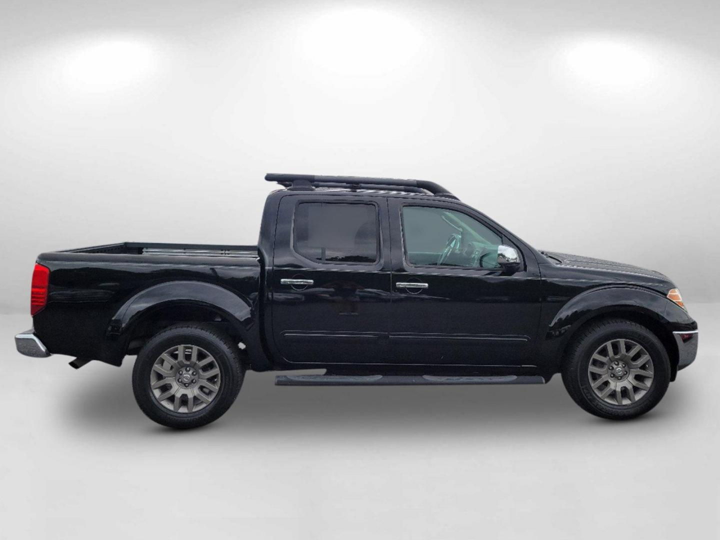 2010 Super Black /Graphite Nissan Frontier LE (1N6AD0ER7AC) with an Gas V6 4.0L/ engine, 5-Speed Automatic w/OD transmission, located at 7000 Northlake Connector, Columbus, GA, 31904, (706) 987-8085, 32.524975, -84.978134 - 2010 Nissan Frontier LE - Photo#3