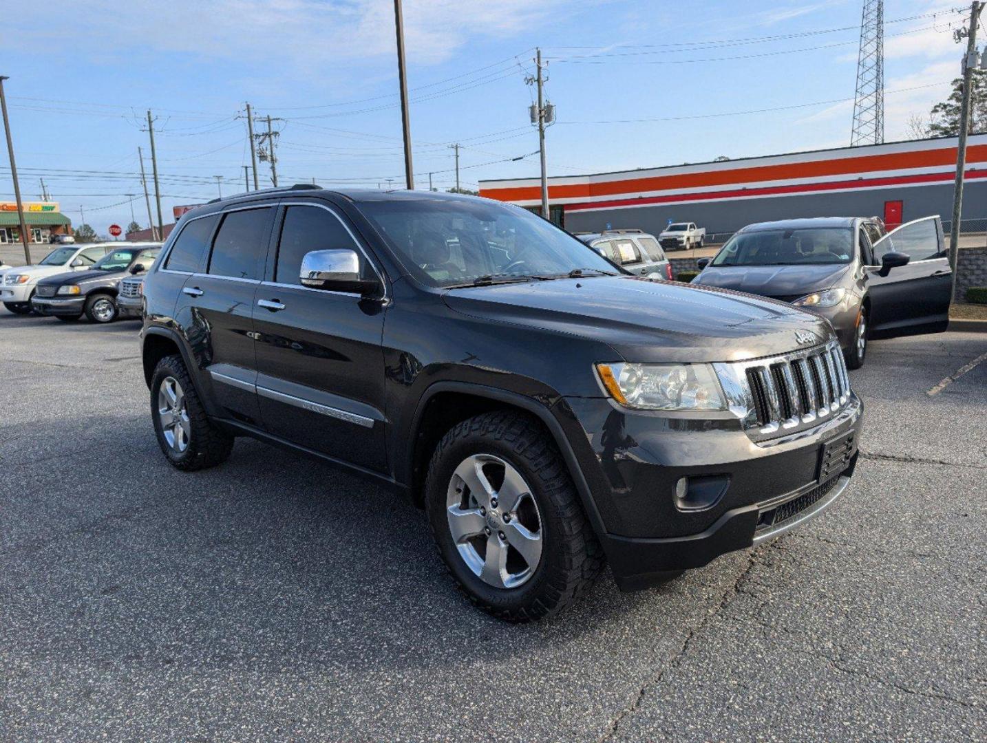 2011 /Black Interior Jeep Grand Cherokee Limited (1J4RS5GG5BC) with an Gas/Ethanol V6 3.6L/220 engine, 5-Speed Automatic transmission, located at 3959 U.S. 80 W, Phenix City, AL, 36870, (334) 297-4885, 32.469296, -85.135185 - 2011 Jeep Grand Cherokee Limited - Photo#2