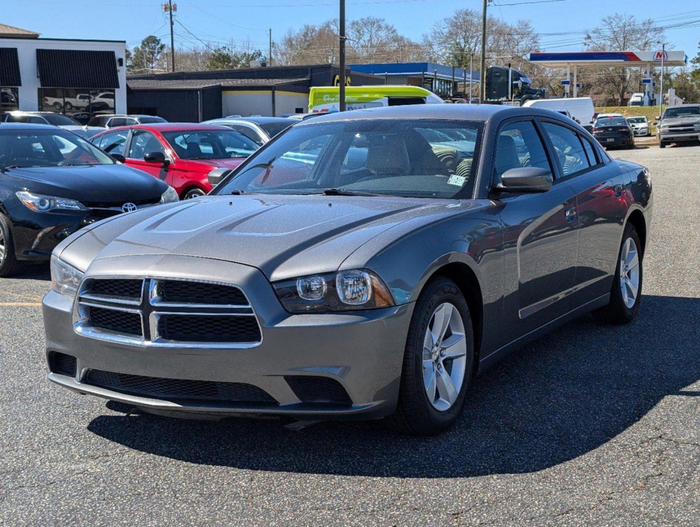 2012 /Black/Light Frost Beige Interior Dodge Charger SE (2C3CDXBG0CH) with an Gas V6 3.6L/220 engine, 5-Speed Automatic transmission, located at 3959 U.S. 80 W, Phenix City, AL, 36870, (334) 297-4885, 32.469296, -85.135185 - 2012 Dodge Charger SE - Photo#0