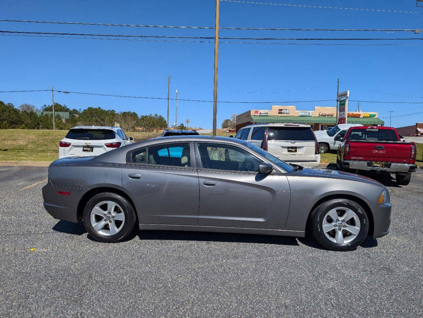 2012 /Black/Light Frost Beige Interior Dodge Charger SE (2C3CDXBG0CH) with an Gas V6 3.6L/220 engine, 5-Speed Automatic transmission, located at 3959 U.S. 80 W, Phenix City, AL, 36870, (334) 297-4885, 32.469296, -85.135185 - 2012 Dodge Charger SE - Photo#3