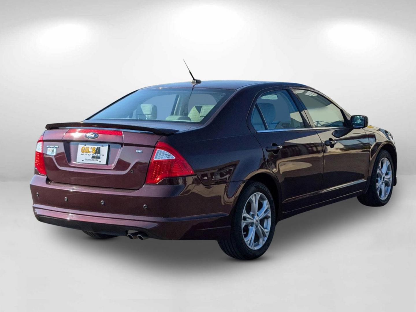 2012 Maroon Ford Fusion SE (3FAHP0HA0CR) with an Gas I4 2.5L/152 engine, 6-Speed Automatic transmission, located at 804 22nd Ave, Phenix City, AL, 36870, (334) 297-1860, 32.484749, -85.024475 - 2012 Ford Fusion SE - Photo#2