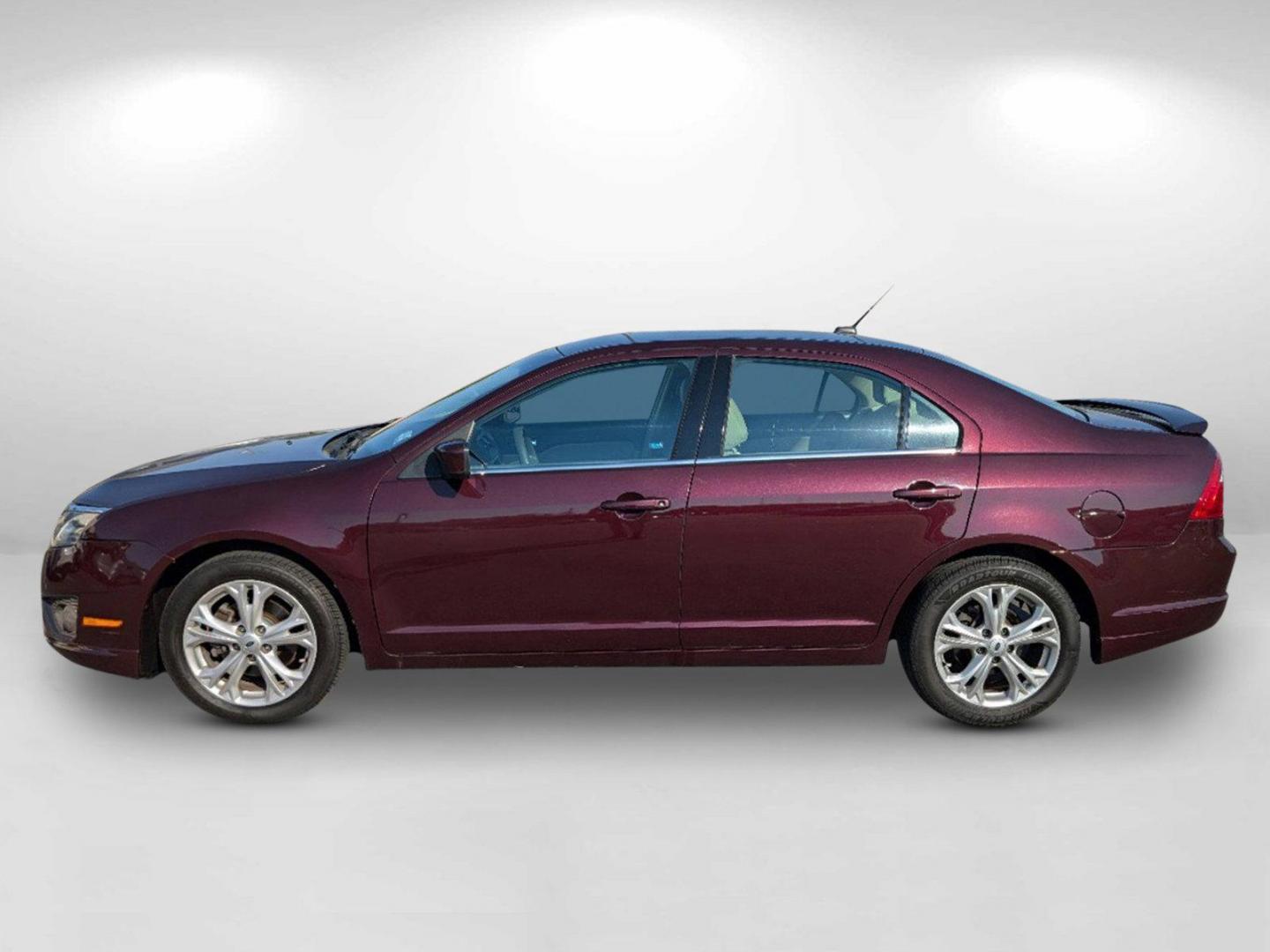 2012 Maroon Ford Fusion SE (3FAHP0HA0CR) with an Gas I4 2.5L/152 engine, 6-Speed Automatic transmission, located at 804 22nd Ave, Phenix City, AL, 36870, (334) 297-1860, 32.484749, -85.024475 - 2012 Ford Fusion SE - Photo#5