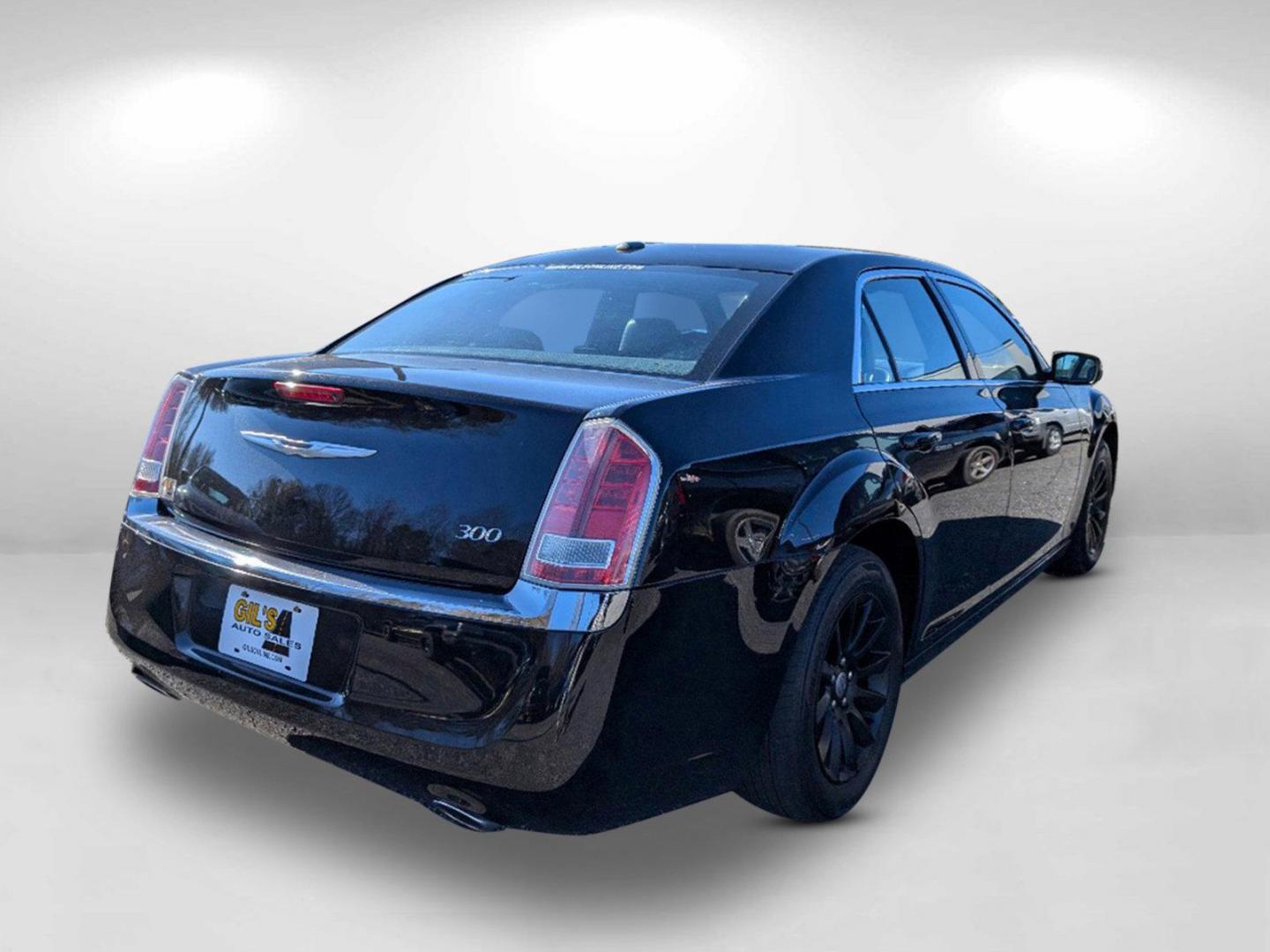 2013 /Black Chrysler 300 (2C3CCAAG8DH) with an Gas/Ethanol V6 3.6L/220 engine, 8-Speed Automatic transmission, located at 804 22nd Ave, Phenix City, AL, 36870, (334) 297-1860, 32.484749, -85.024475 - 2013 Chrysler 300 - Photo#4