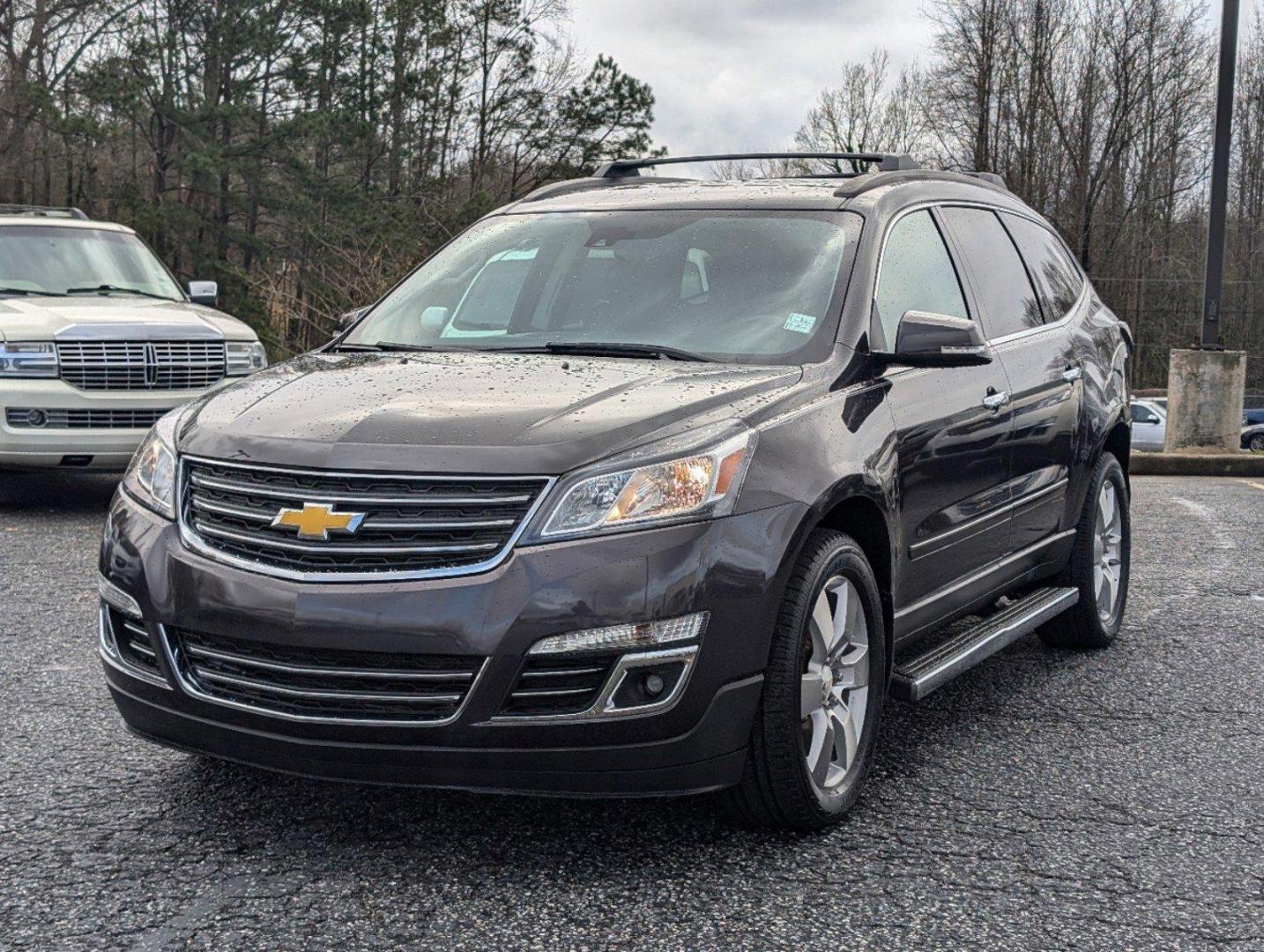 2015 /Ebony Chevrolet Traverse LTZ (1GNKRJKD8FJ) with an Gas V6 3.6L/217 engine, 6-Speed Automatic transmission, located at 3959 U.S. 80 W, Phenix City, AL, 36870, (334) 297-4885, 32.469296, -85.135185 - 2015 Chevrolet Traverse LTZ - Photo#0