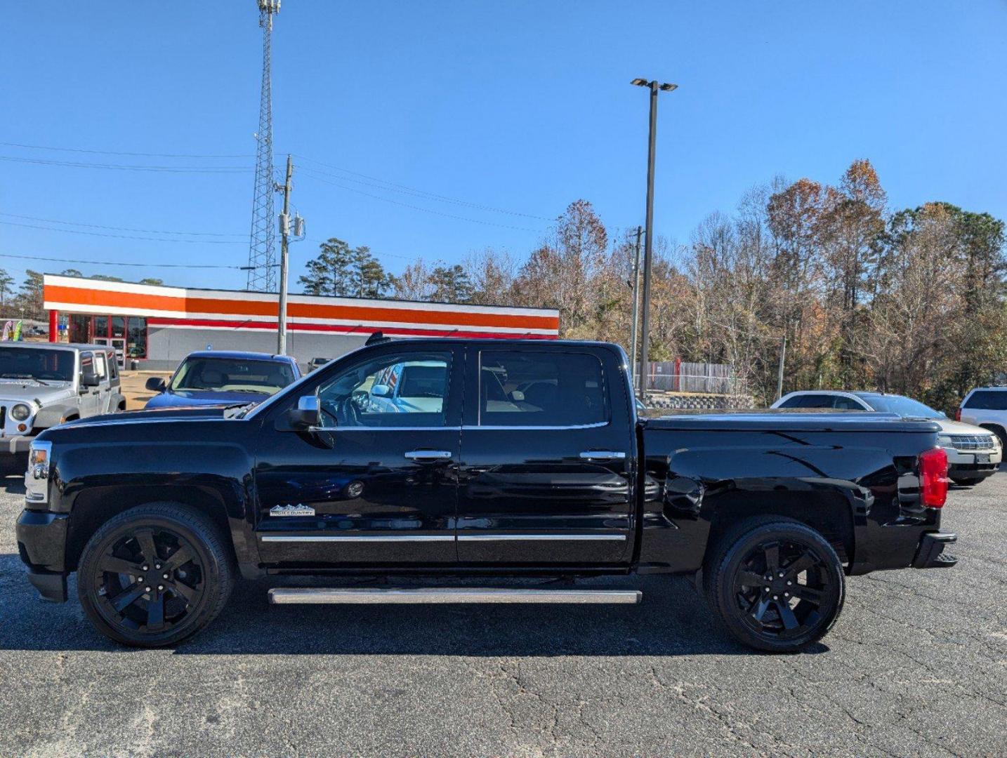 2016 /Saddle Chevrolet Silverado 1500 High Country (3GCPCTEJXGG) with an Gas V8 6.2L/376 engine, 8-Speed Automatic transmission, located at 3959 U.S. 80 W, Phenix City, AL, 36870, (334) 297-4885, 32.469296, -85.135185 - 2016 Chevrolet Silverado 1500 High Country - Photo#7