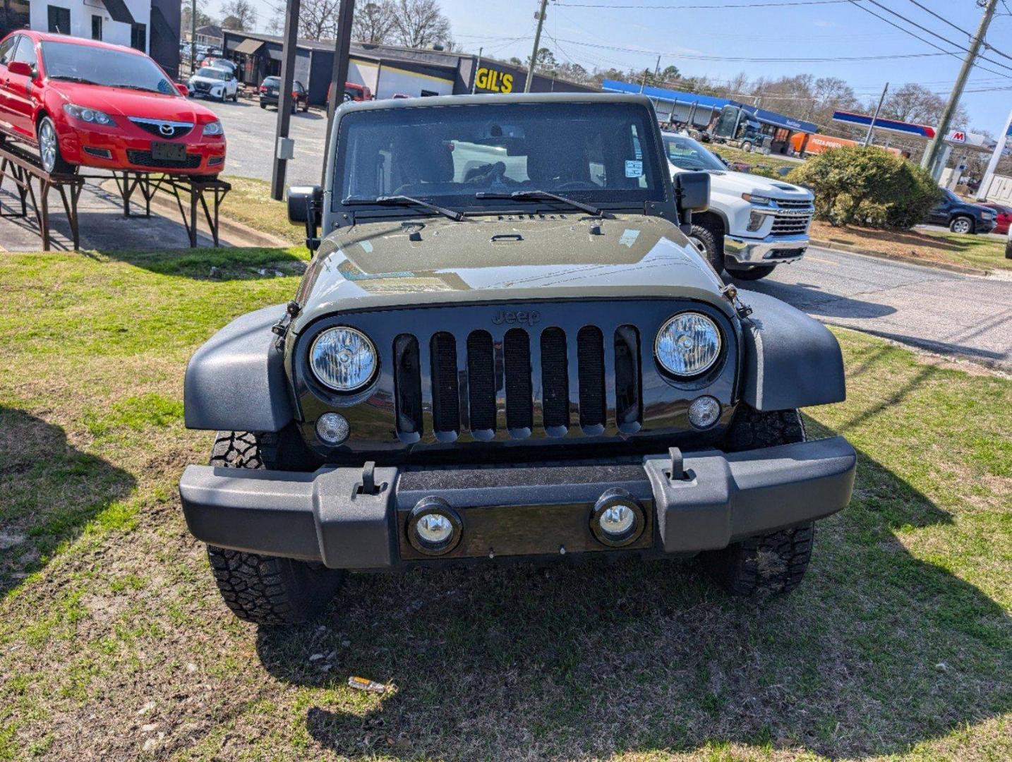 2016 /Black Jeep Wrangler Unlimited Willys Wheeler (1C4BJWDG9GL) with an Regular Unleaded V-6 3.6 L/220 engine, 6-Speed Manual w/OD transmission, located at 804 22nd Ave, Phenix City, AL, 36870, (334) 297-1860, 32.484749, -85.024475 - 2016 Jeep Wrangler Unlimited Willys Wheeler - Photo#1