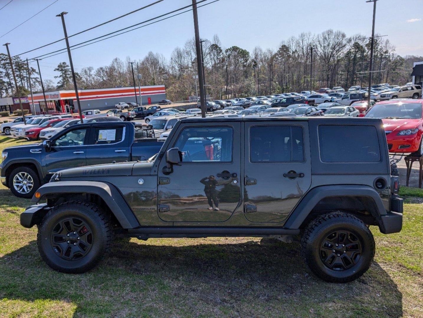 2016 /Black Jeep Wrangler Unlimited Willys Wheeler (1C4BJWDG9GL) with an Regular Unleaded V-6 3.6 L/220 engine, 6-Speed Manual w/OD transmission, located at 804 22nd Ave, Phenix City, AL, 36870, (334) 297-1860, 32.484749, -85.024475 - 2016 Jeep Wrangler Unlimited Willys Wheeler - Photo#7