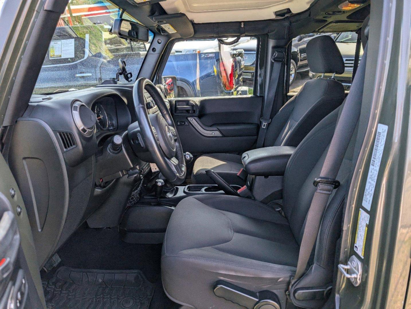 2016 /Black Jeep Wrangler Unlimited Willys Wheeler (1C4BJWDG9GL) with an Regular Unleaded V-6 3.6 L/220 engine, 6-Speed Manual w/OD transmission, located at 804 22nd Ave, Phenix City, AL, 36870, (334) 297-1860, 32.484749, -85.024475 - 2016 Jeep Wrangler Unlimited Willys Wheeler - Photo#9