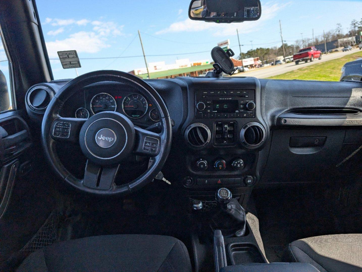 2016 /Black Jeep Wrangler Unlimited Willys Wheeler (1C4BJWDG9GL) with an Regular Unleaded V-6 3.6 L/220 engine, 6-Speed Manual w/OD transmission, located at 804 22nd Ave, Phenix City, AL, 36870, (334) 297-1860, 32.484749, -85.024475 - 2016 Jeep Wrangler Unlimited Willys Wheeler - Photo#11