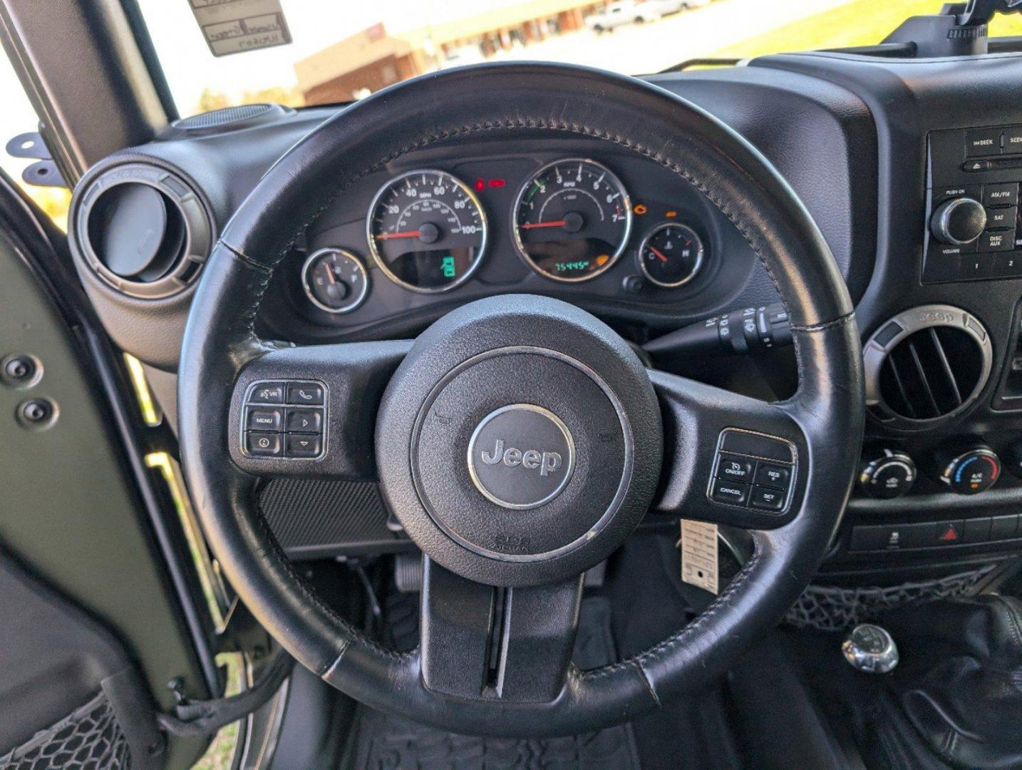 2016 /Black Jeep Wrangler Unlimited Willys Wheeler (1C4BJWDG9GL) with an Regular Unleaded V-6 3.6 L/220 engine, 6-Speed Manual w/OD transmission, located at 804 22nd Ave, Phenix City, AL, 36870, (334) 297-1860, 32.484749, -85.024475 - 2016 Jeep Wrangler Unlimited Willys Wheeler - Photo#14