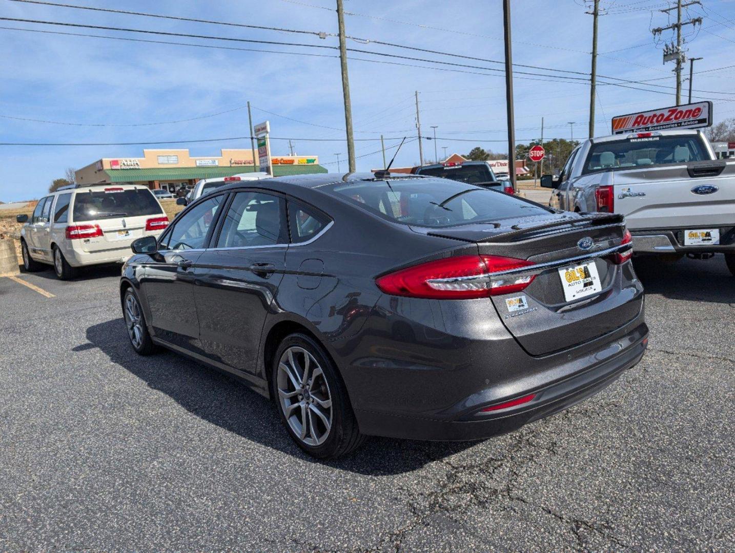 2017 Ford Fusion SE (3FA6P0H77HR) with an Regular Unleaded I-4 2.5 L/152 engine, 6-Speed Automatic w/OD transmission, located at 3959 U.S. 80 W, Phenix City, AL, 36870, (334) 297-4885, 32.469296, -85.135185 - 2017 Ford Fusion SE - Photo#7