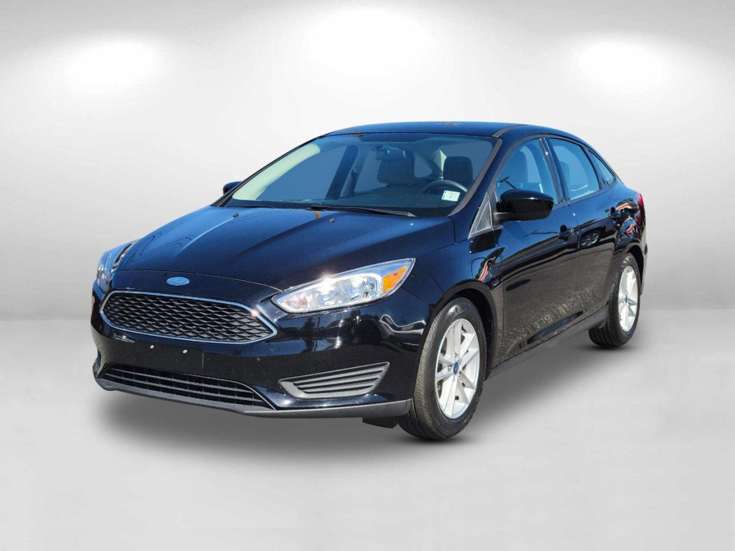 2018 Black Ford Focus SE (1FADP3FEXJL) with an Intercooled Turbo Regular Unleaded I-3 1.0 L/61 engine, located at 3959 U.S. 80 W, Phenix City, AL, 36870, (334) 297-4885, 32.469296, -85.135185 - 2018 Ford Focus SE - Photo#0