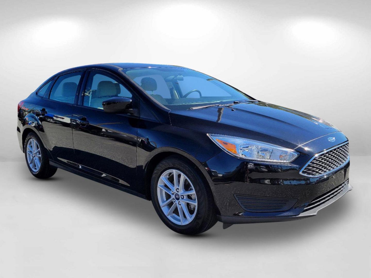 2018 Black Ford Focus SE (1FADP3FEXJL) with an Intercooled Turbo Regular Unleaded I-3 1.0 L/61 engine, located at 3959 U.S. 80 W, Phenix City, AL, 36870, (334) 297-4885, 32.469296, -85.135185 - 2018 Ford Focus SE - Photo#2