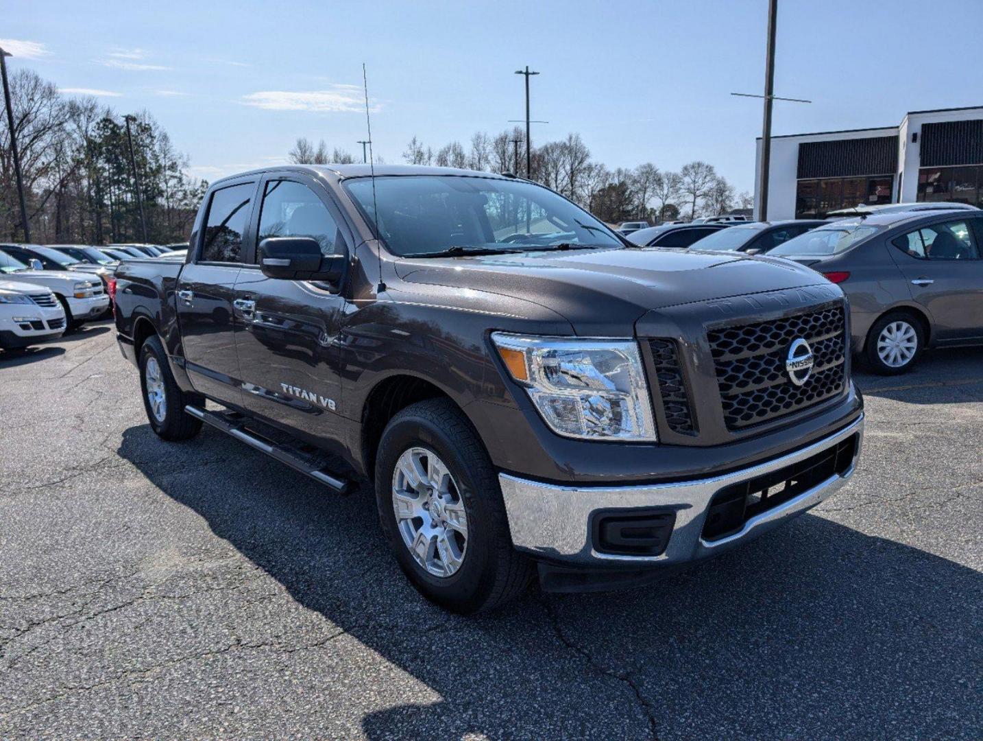 2019 /Black Nissan Titan SV (1N6AA1EK1KN) with an Regular Unleaded V-8 5.6 L/339 engine, 7-Speed Automatic w/OD transmission, located at 804 22nd Ave, Phenix City, AL, 36870, (334) 297-1860, 32.484749, -85.024475 - 2019 Nissan Titan SV - Photo#2