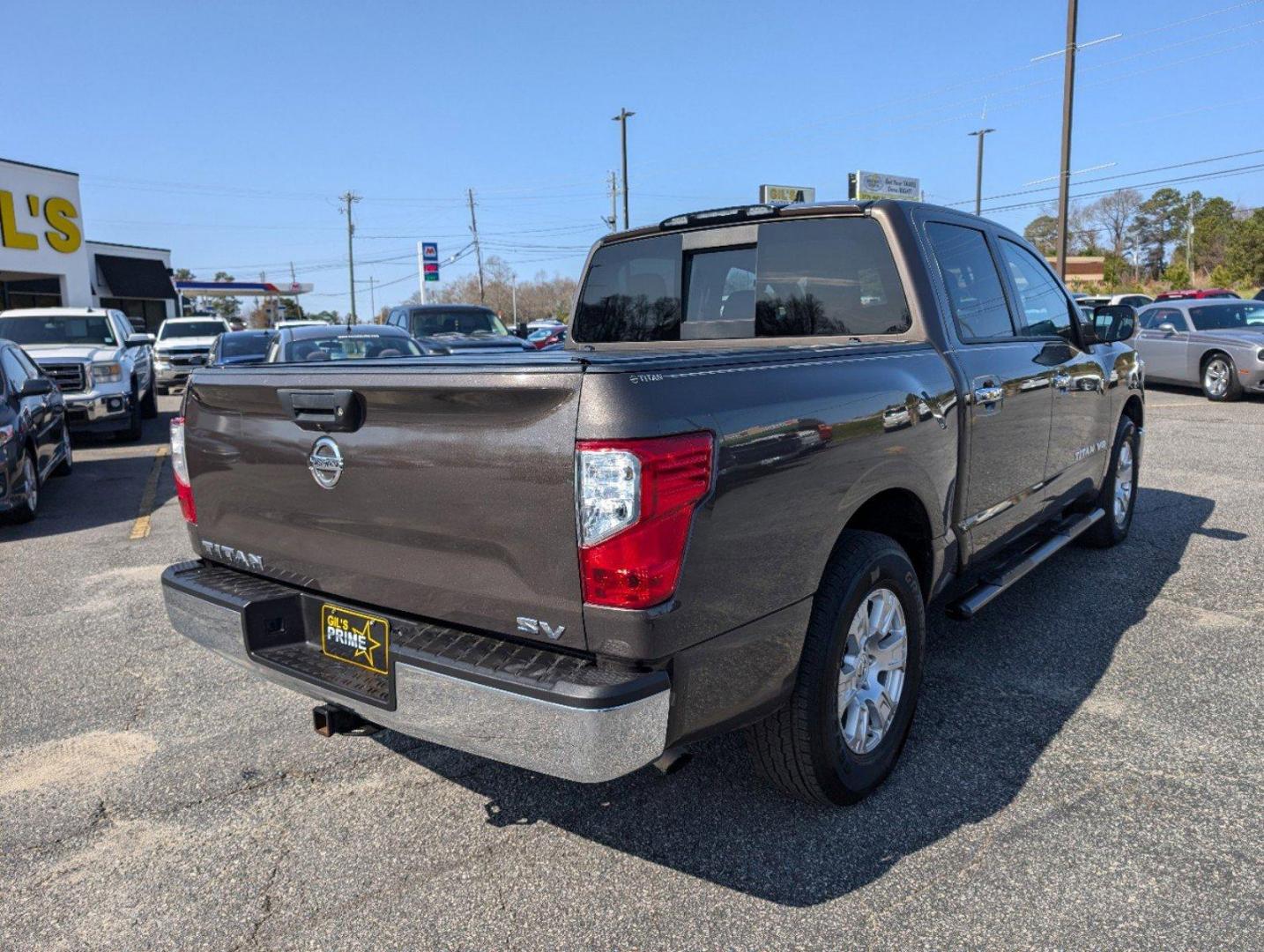 2019 /Black Nissan Titan SV (1N6AA1EK1KN) with an Regular Unleaded V-8 5.6 L/339 engine, 7-Speed Automatic w/OD transmission, located at 804 22nd Ave, Phenix City, AL, 36870, (334) 297-1860, 32.484749, -85.024475 - 2019 Nissan Titan SV - Photo#4