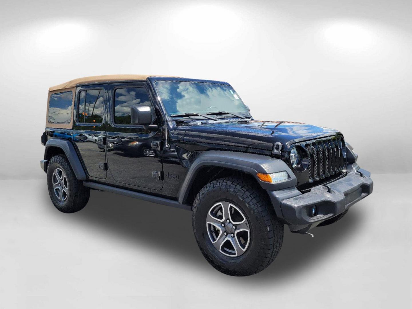 2020 Black Clearcoat /Heritage Tan/Black Jeep Wrangler Unlimited Black and Tan (1C4HJXDG9LW) with an Regular Unleaded V-6 3.6 L/220 engine, 8-Speed Automatic w/OD transmission, located at 1430 Gateway Drive, Opelika, AL, 36801, (334) 239-0944, 32.637871, -85.409790 - 2020 Jeep Wrangler Unlimited Black and Tan - Photo#2