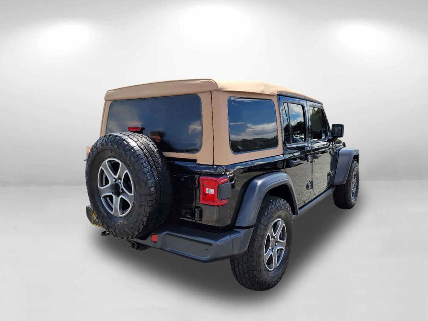 2020 Black Clearcoat /Heritage Tan/Black Jeep Wrangler Unlimited Black and Tan (1C4HJXDG9LW) with an Regular Unleaded V-6 3.6 L/220 engine, 8-Speed Automatic w/OD transmission, located at 1430 Gateway Drive, Opelika, AL, 36801, (334) 239-0944, 32.637871, -85.409790 - 2020 Jeep Wrangler Unlimited Black and Tan - Photo#4