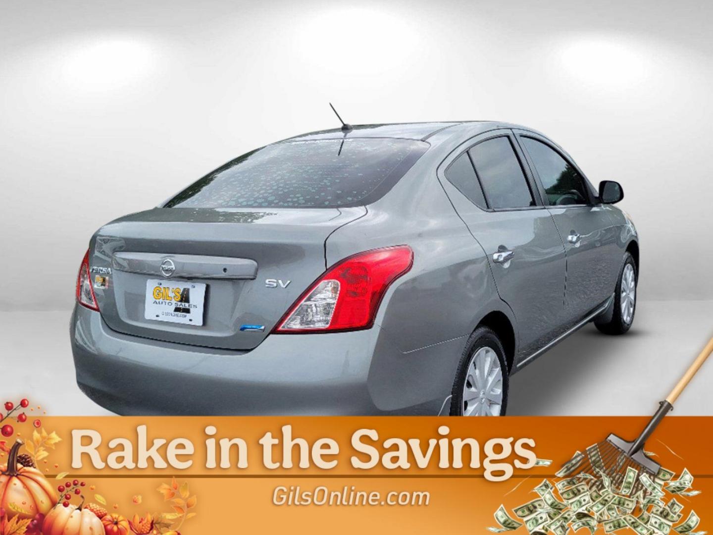 2012 Magnetic Gray Metallic /Charcoal Nissan Versa SV (3N1CN7AP2CL) with an Gas I4 1.6L/97 engine, 1-Speed Continuously Variable transmission, located at 7000 Northlake Connector, Columbus, GA, 31904, (706) 987-8085, 32.524975, -84.978134 - 2012 Nissan Versa SV - Photo#4